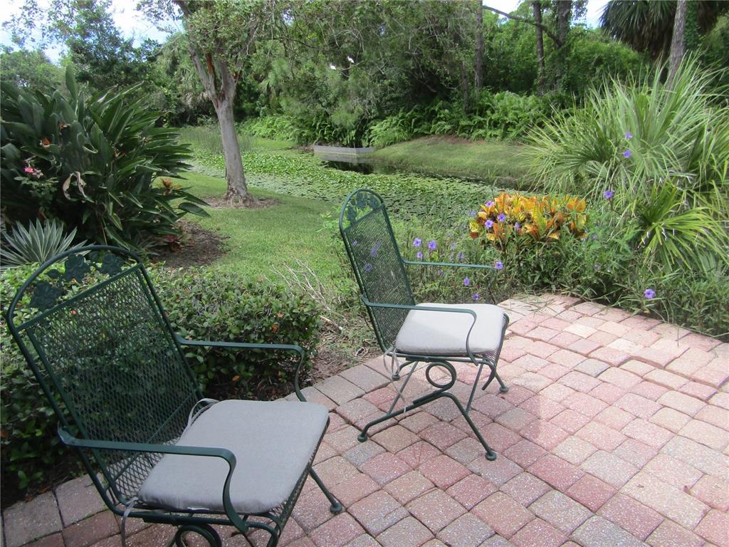 4137 Bella Pasque Venice, FL 34293 - Photo 8 of 30 a view of a chairs and table in the garden
