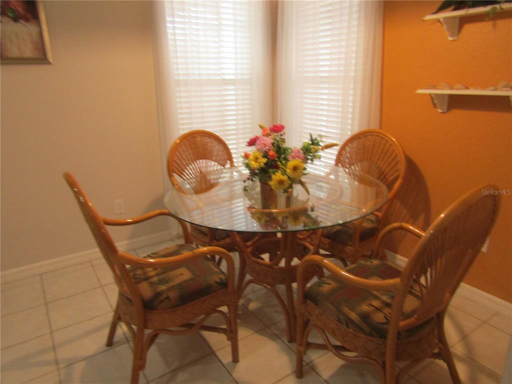 4137 Bella Pasque Venice, FL 34293 - Photo 10 of 30 a view of a dining room with furniture and window