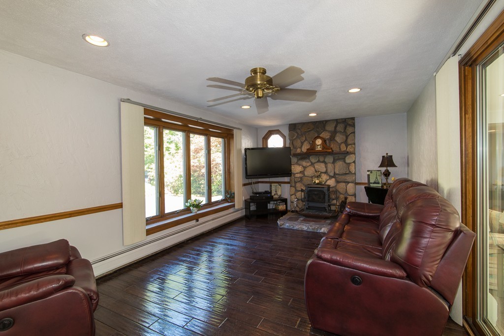 18 Dignon Road Billerica, MA 01821 - Photo 8 of 30 a living room with furniture ceiling fan and a window