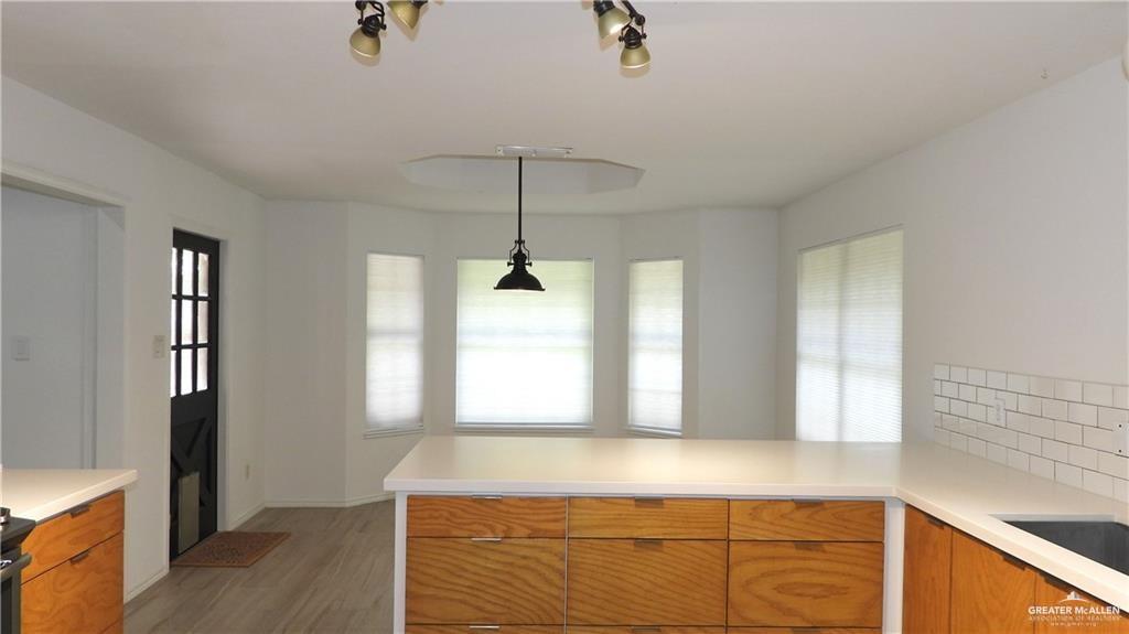 2301 Anacua Circle Edinburg, TX 78539 - Photo 5 of 12 a view of an empty room with window and wooden floor