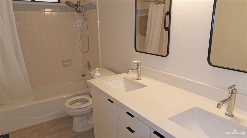 2301 Anacua Circle Edinburg, TX 78539 - Photo 8 of 12 a bathroom with a sink toilet and shower