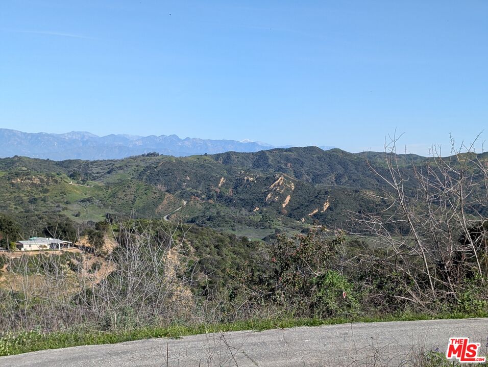 2000 Corsham Road Topanga, CA 90290 - Photo 14 of 29 a view of a mountain in the distance in a field