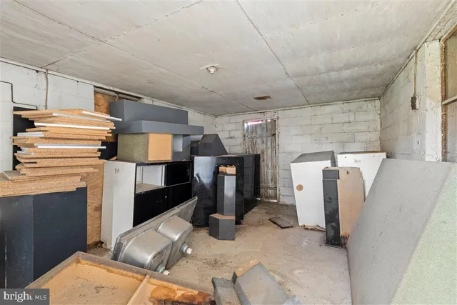 a view of a field of grass and trees