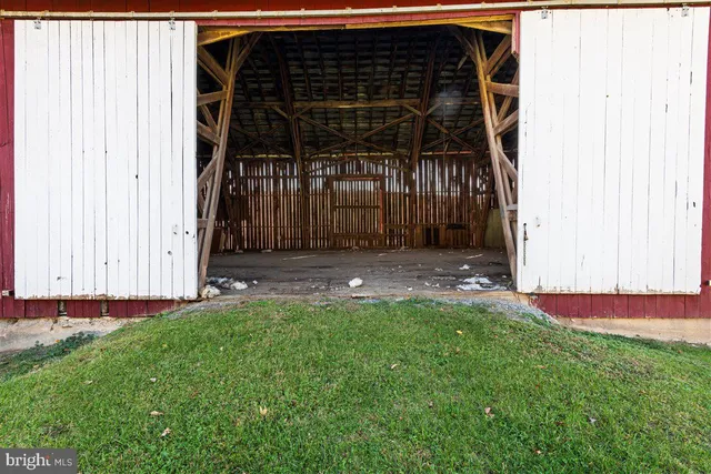 a view of backyard with cabin