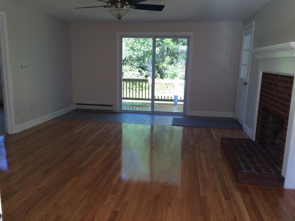 4 Susan Circle Norton, MA 02766 - Photo 11 of 22 a view of a livingroom with wooden floor and a window