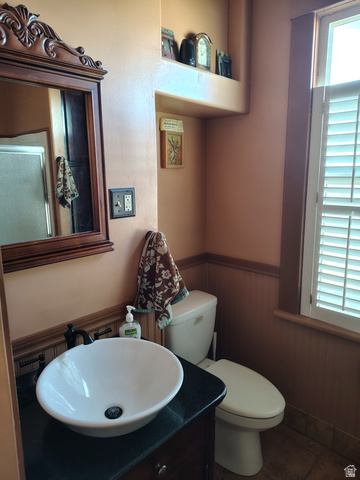 5264 West 5500th Street South Hooper, UT 84315 - Photo 16 of 20 Half bath with a wainscoted wall, vanity, and wood walls