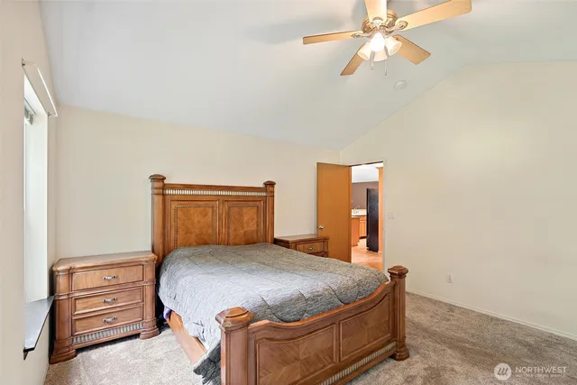 a bedroom with a bed and cabinets