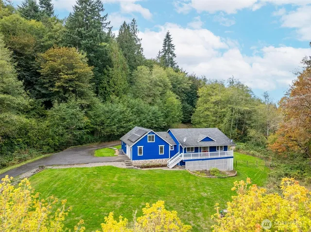a view of a house with a big yard