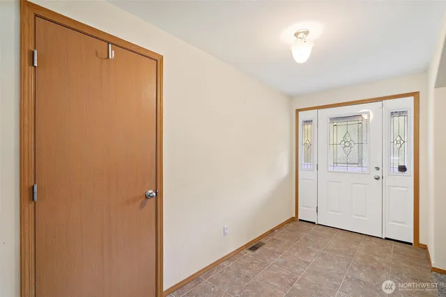 a view of an empty room with a window