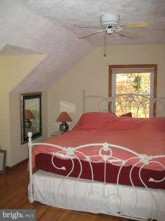 123 North Longcross Road Linthicum, MD 21090 - Photo 4 of 22 a bedroom with a large bed and window