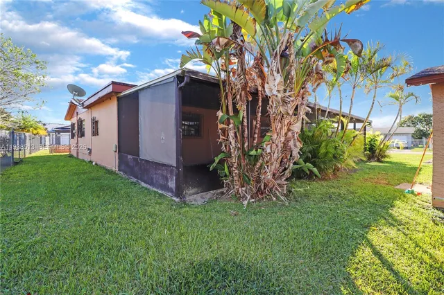 a view of backyard with a garden and plants