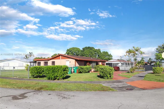 a view of a house with a street