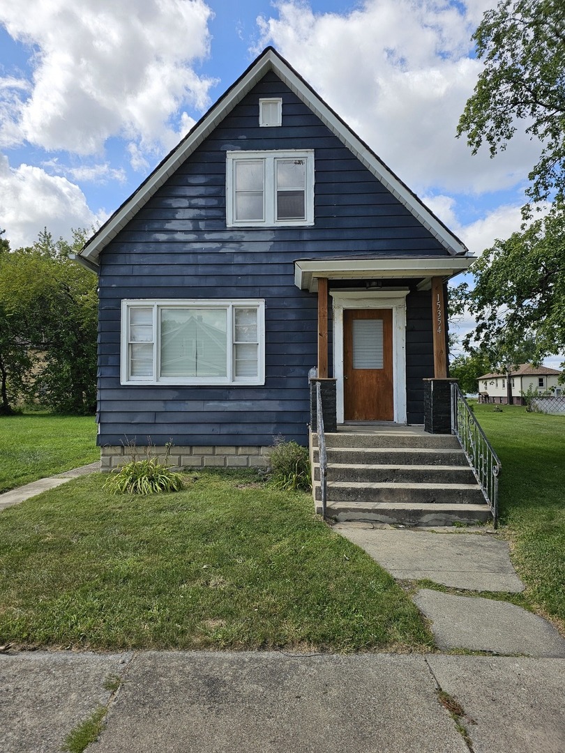 15354 5th Avenue Phoenix, IL 60426 - Photo 1 of 5 a view of a house with a yard