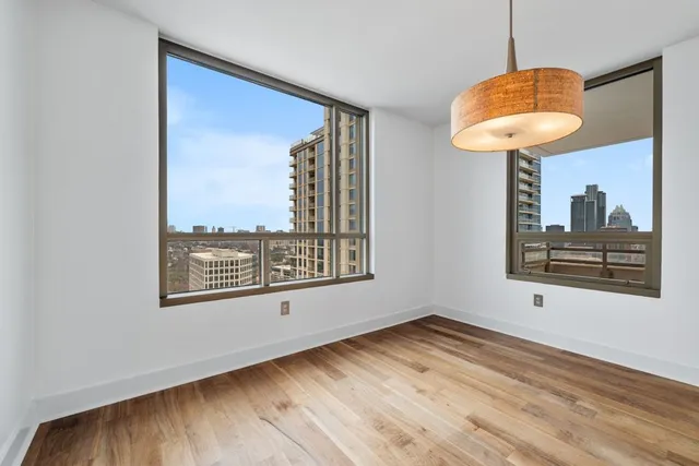 a kitchen with granite countertop a sink and cabinets
