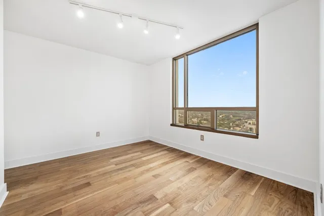 a view of a kitchen with a sink and a window
