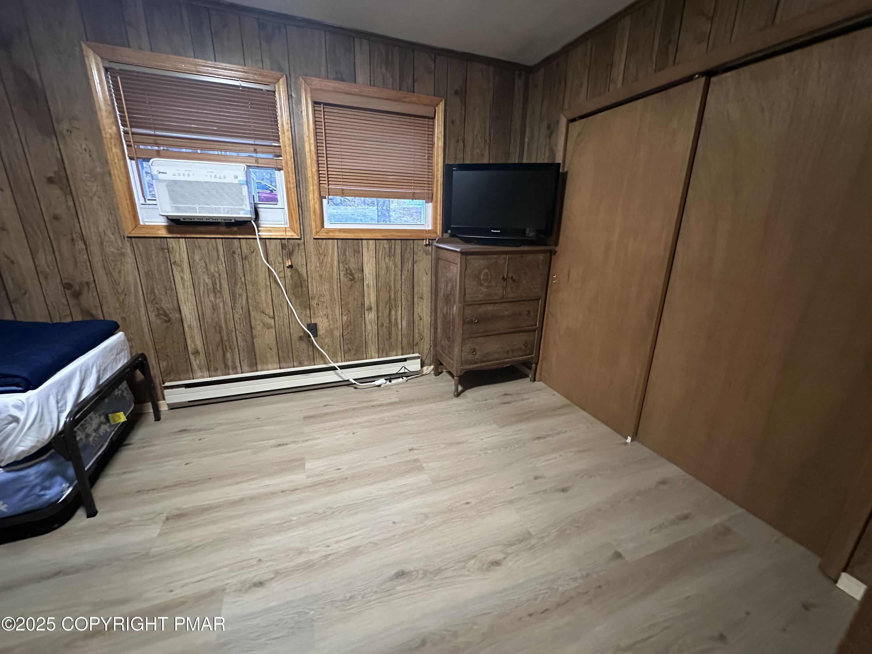 5880 Decker Road Bushkill, PA 18324 - Photo 12 of 51 a view of an empty room with wooden floor and a window
