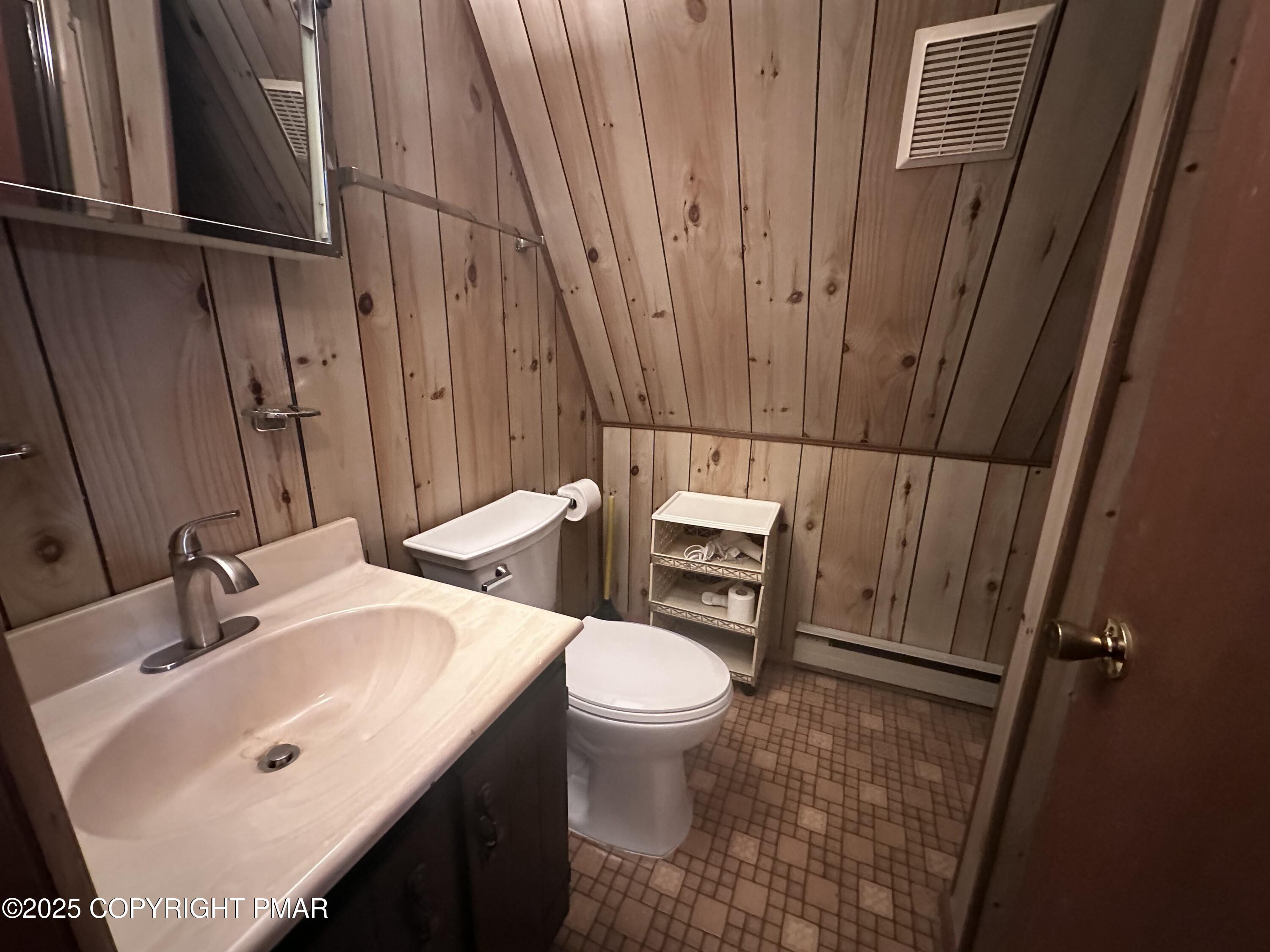5880 Decker Road Bushkill, PA 18324 - Photo 13 of 51 a bathroom with a sink and toilet