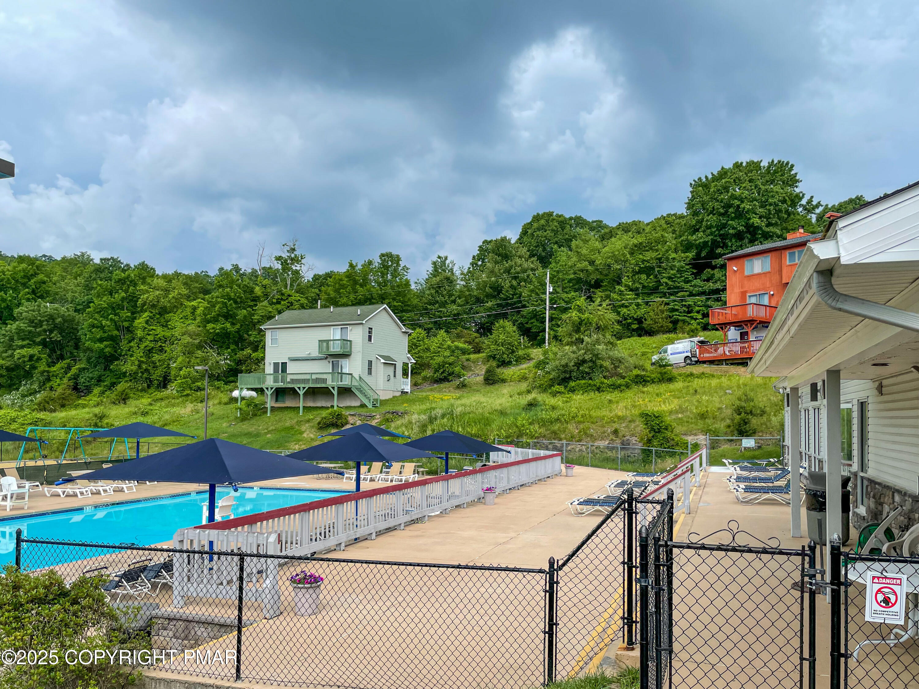 5880 Decker Road Bushkill, PA 18324 - Photo 36 of 51 an aerial view of a house with a yard basket ball court and outdoor seating