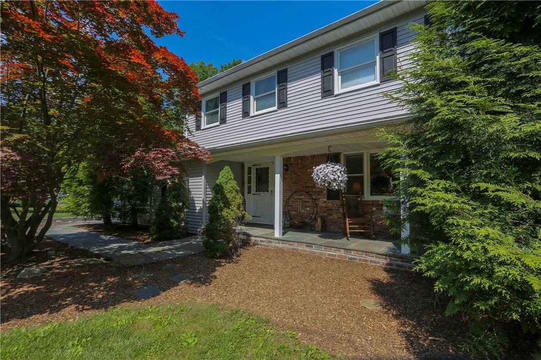 a view of a house with backyard porch and garden