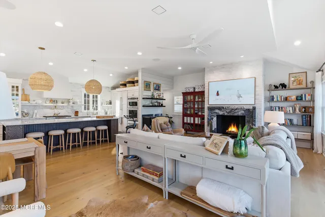 an aerial view of a house with outdoor seating