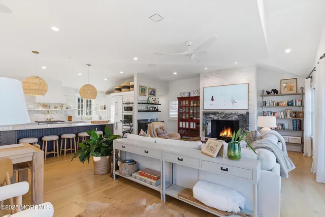 an aerial view of a house with a swimming pool patio and outdoor seating