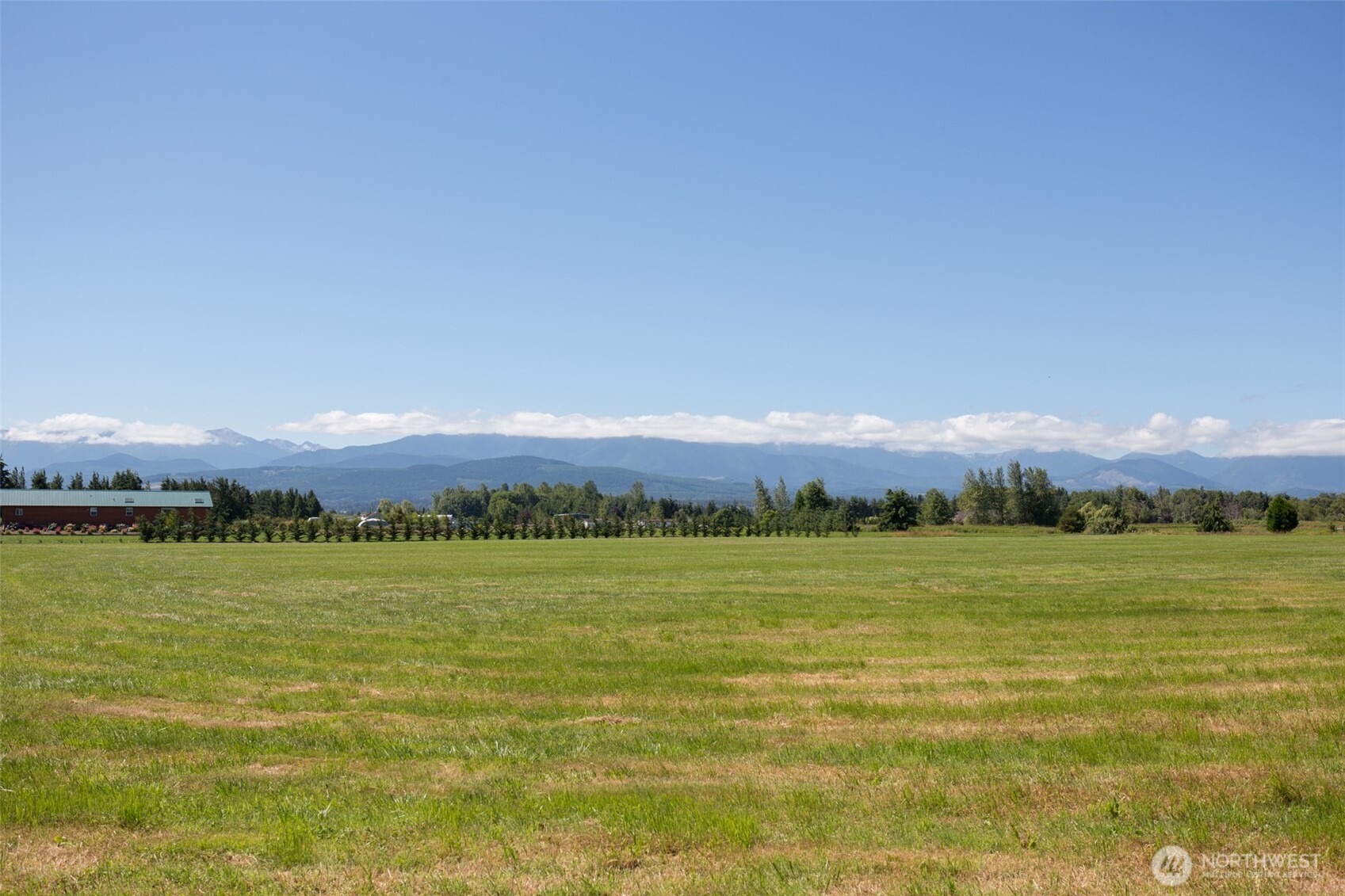 0 Buttercup Lane Sequim, WA 98382 - Photo 18 of 32 a view of a lake with a mountain