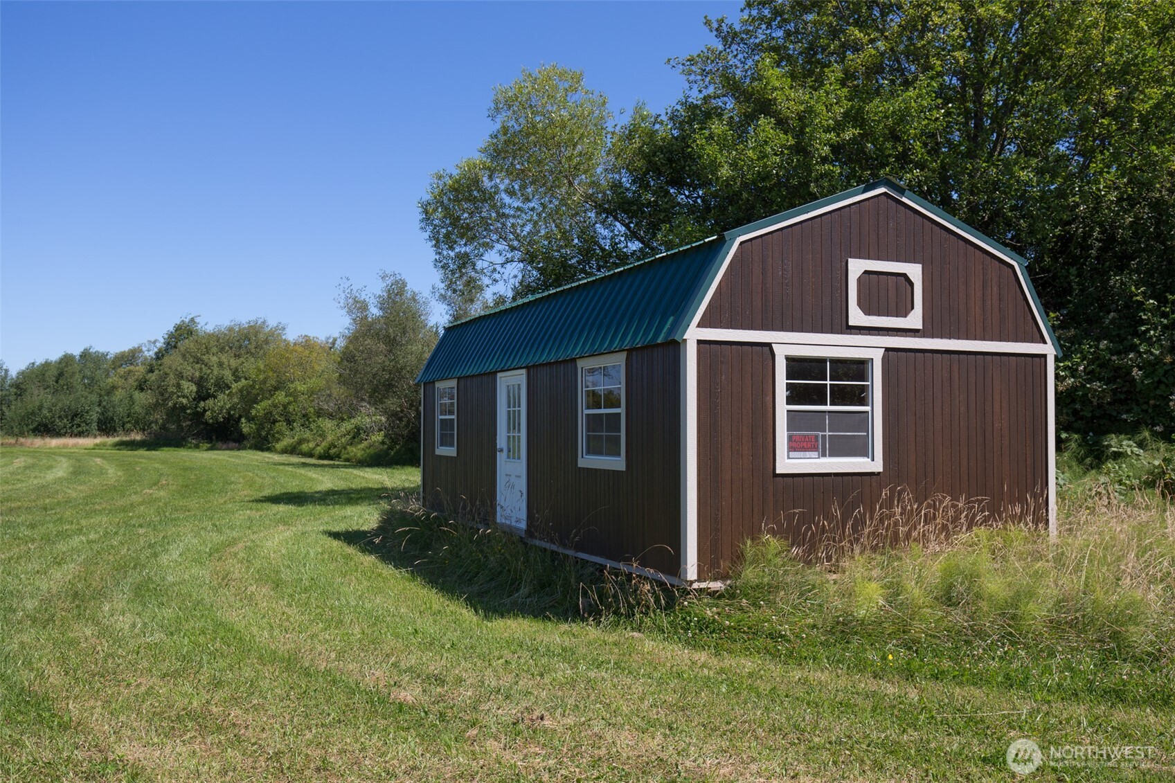0 Buttercup Lane Sequim, WA 98382 - Photo 3 of 32 a front view of a house with garden