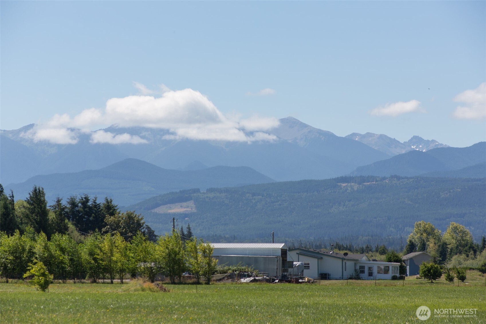 0 Buttercup Lane Sequim, WA 98382 - Photo 7 of 32 a view of a house with a yard and a pond