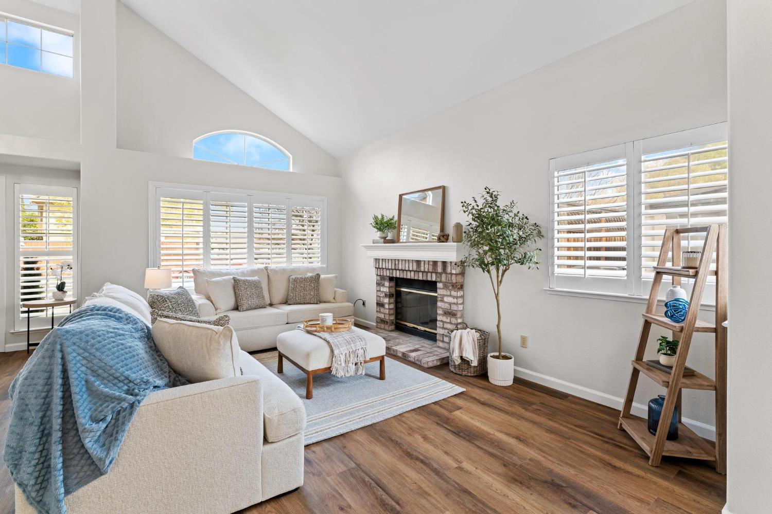716 Hemmingway Court Tracy, CA 95376 - Photo 11 of 41 a living room with furniture and a fireplace