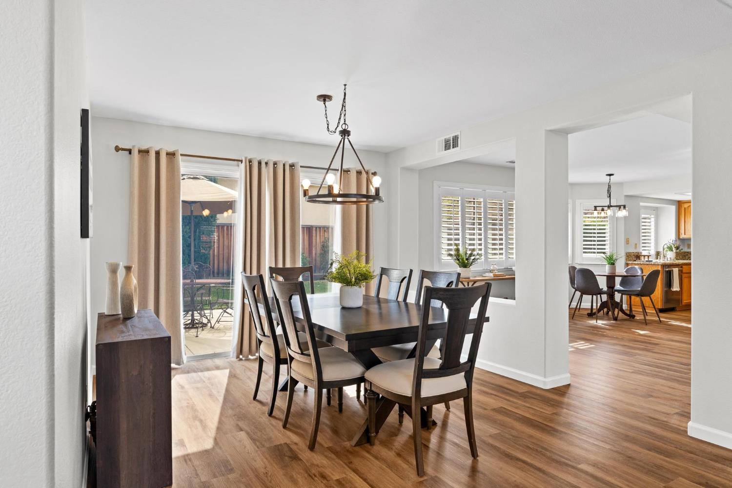 716 Hemmingway Court Tracy, CA 95376 - Photo 13 of 41 a view of a dining room with furniture and wooden floor