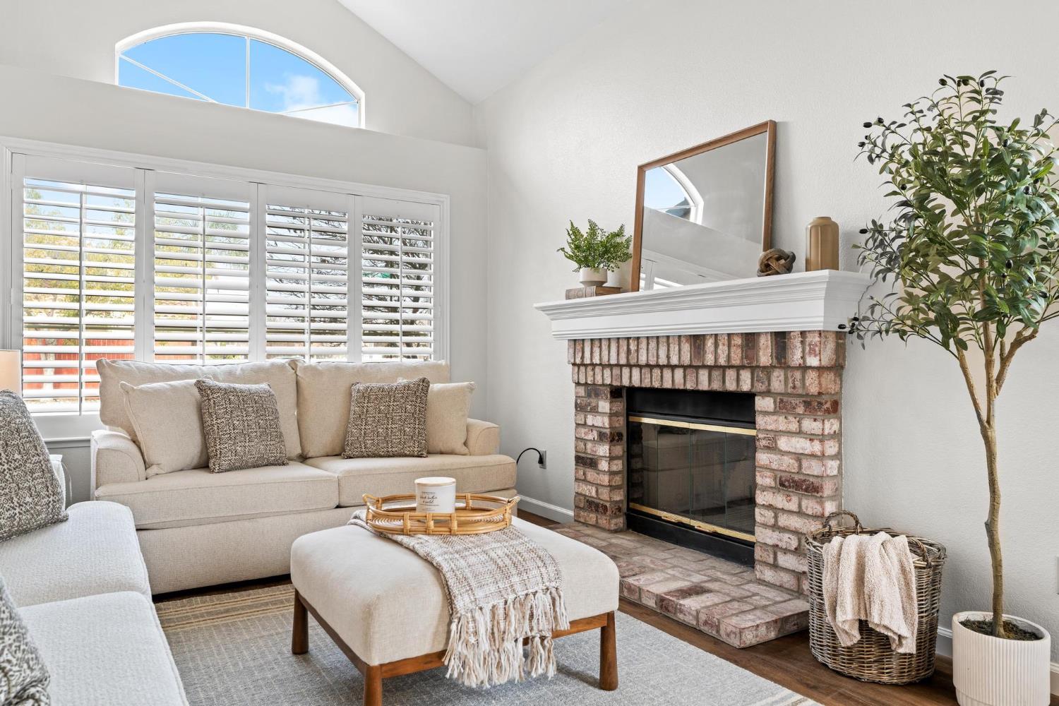 716 Hemmingway Court Tracy, CA 95376 - Photo 2 of 41 a living room with furniture and a fireplace
