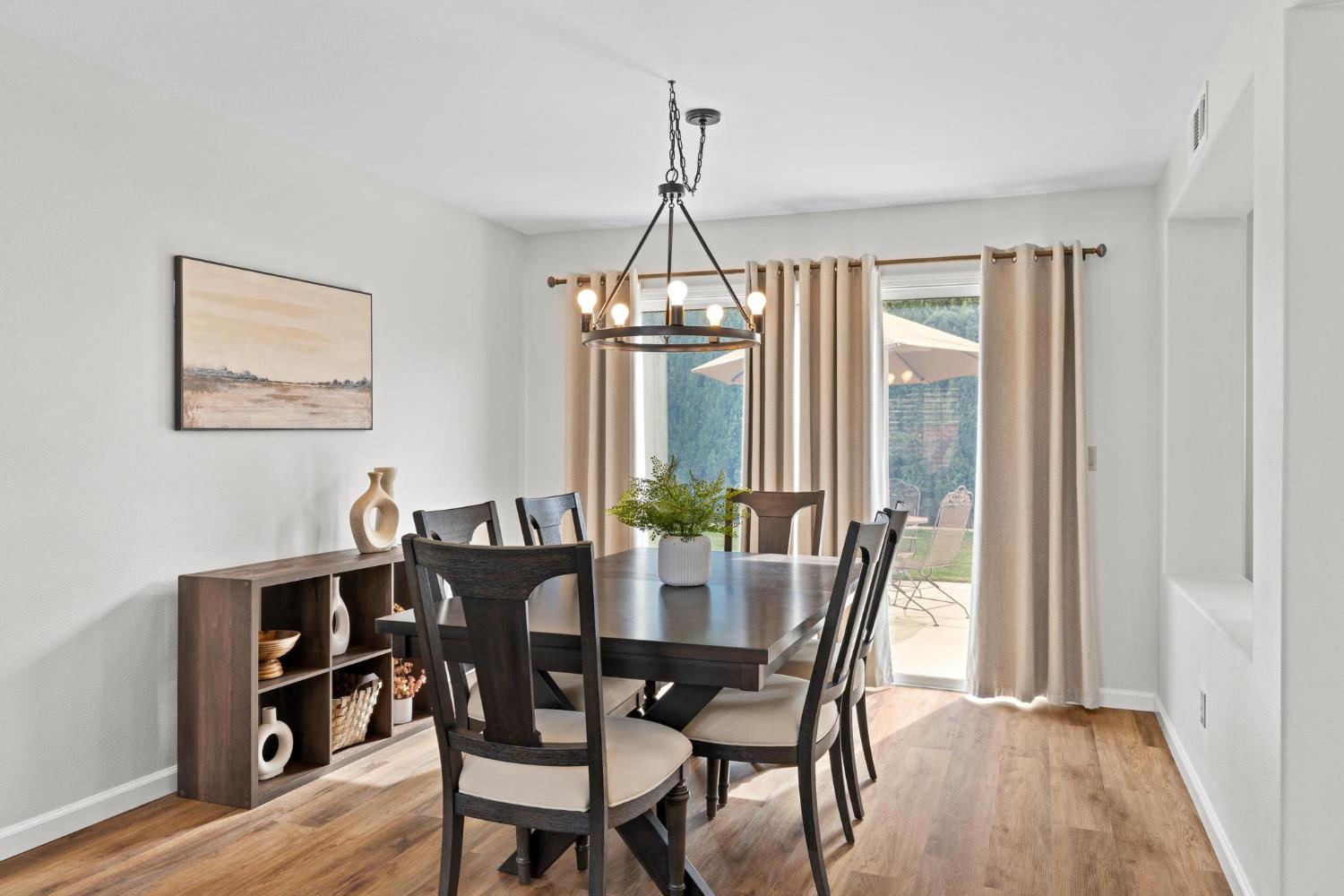 716 Hemmingway Court Tracy, CA 95376 - Photo 4 of 41 a view of a dining room with furniture window and wooden floor