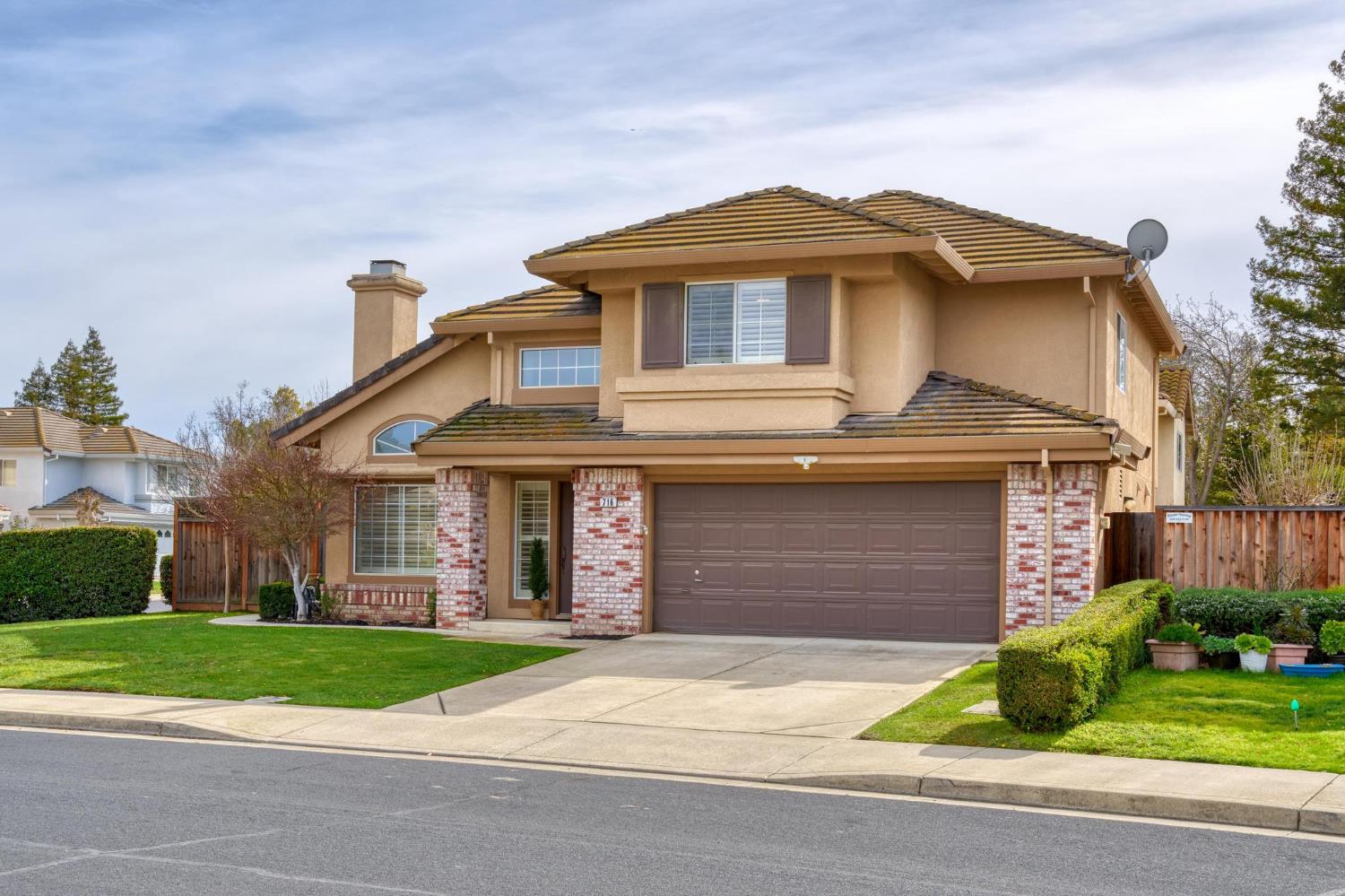 716 Hemmingway Court Tracy, CA 95376 - Photo 7 of 41 a front view of a house with a yard and garage