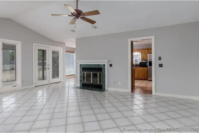 a view of an empty room with a fireplace