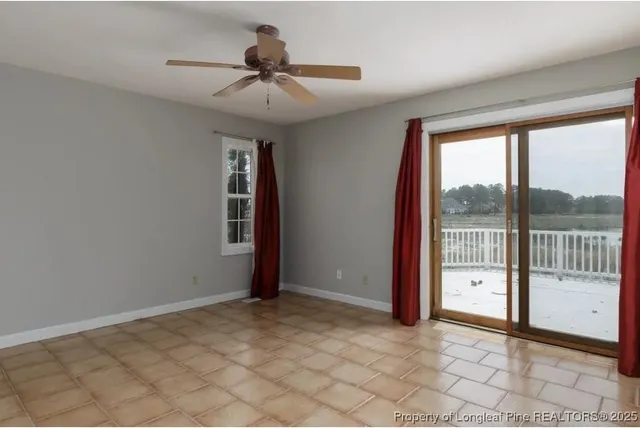 a view of an empty room and window