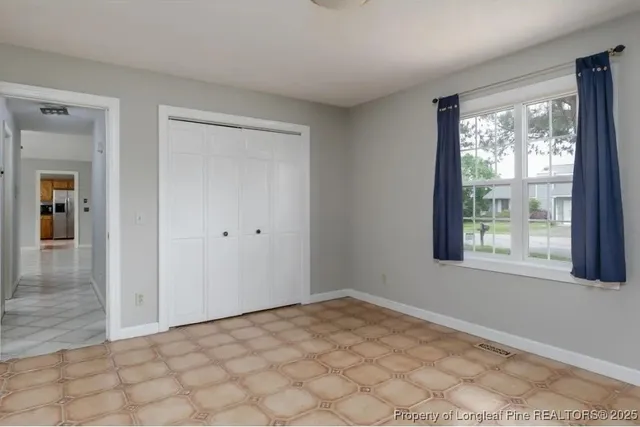 a view of an empty room and window