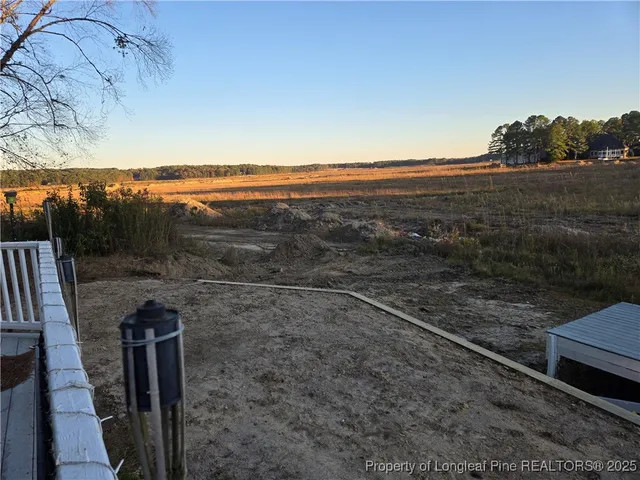 a view of a yard with an outdoor space