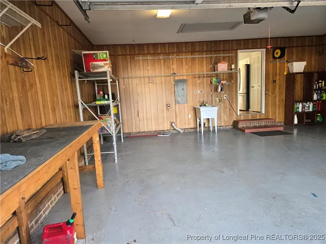a view of a big room with air conditioner duct and materials on floor