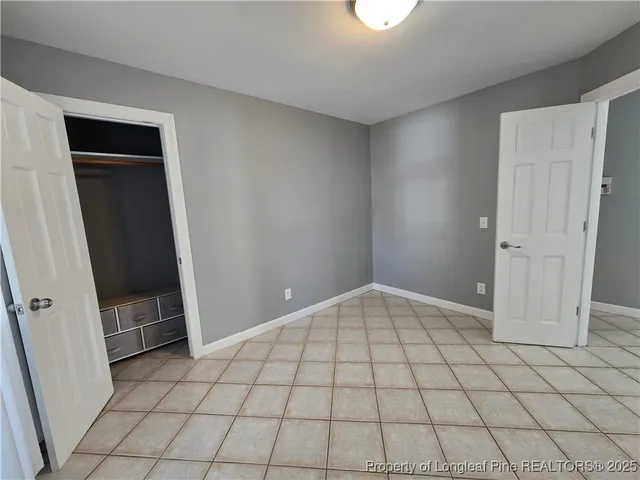 a bathroom with a toilet sink and shower