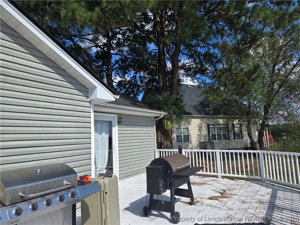 692 Cedar Point Vass, NC 28394 - Photo 4 of 46 a view of a chair and tables in the balcony