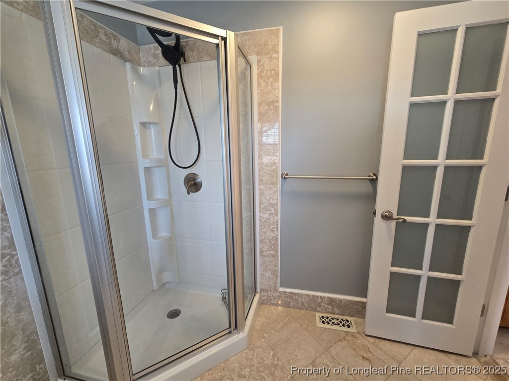 692 Cedar Point Vass, NC 28394 - Photo 43 of 46 a bathroom with a glass shower door and a mirror