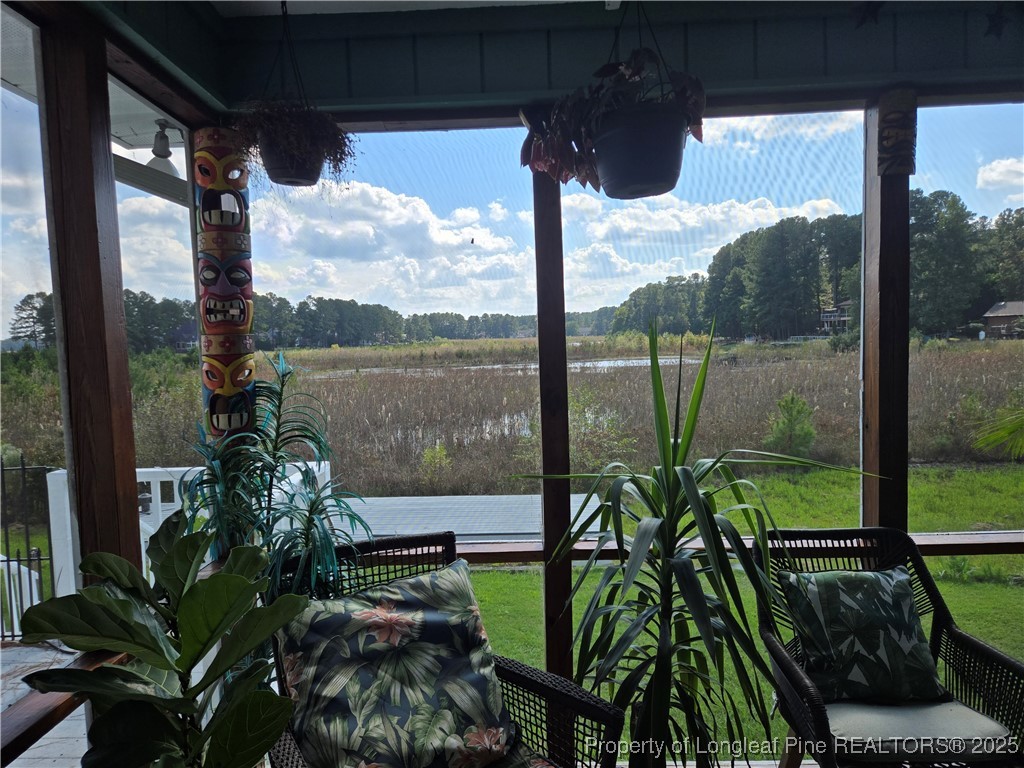 692 Cedar Point Vass, NC 28394 - Photo 9 of 46 a view of a balcony with lake view and a potted plant