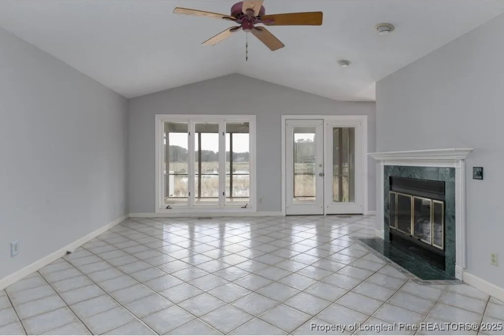 692 Cedar Point Vass, NC 28394 - Photo 10 of 46 a view of an empty room with a fireplace and a window