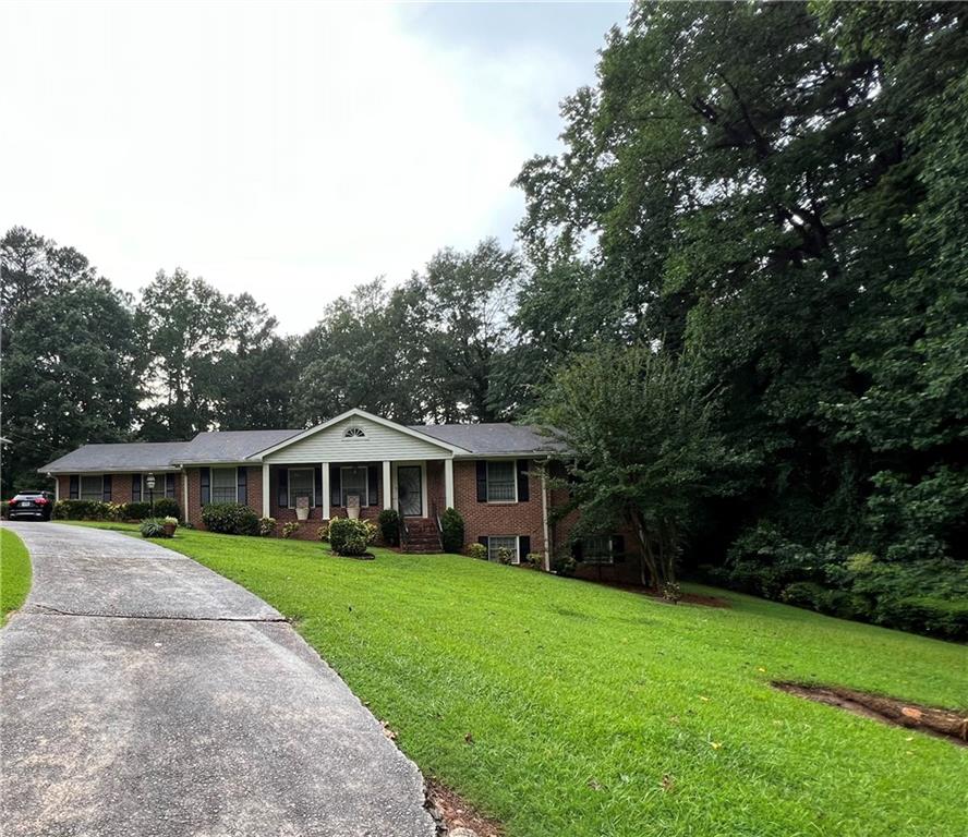 2909 Chukar Trail Decatur, GA 30034 - Photo 1 of 1 a view of house with a yard and potted plants