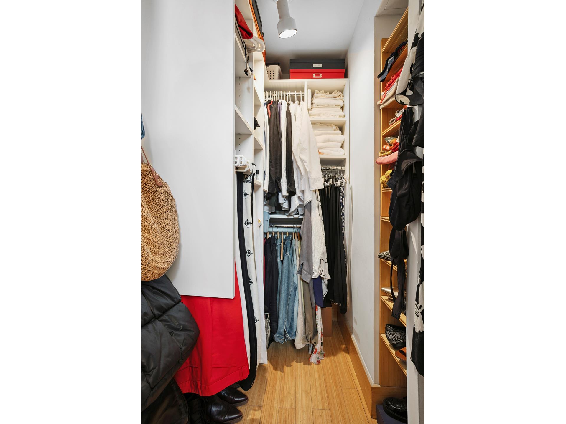 269 West 72nd Street, Unit 16D Manhattan, NY 10023 - Photo 4 of 7 a view of walk in closet with clothes and shoes
