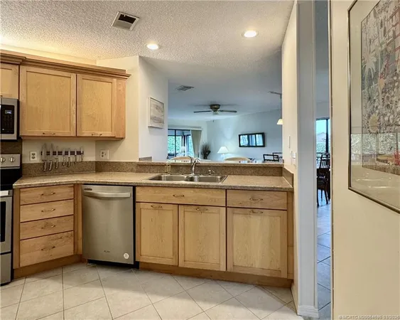 a kitchen with a refrigerator stove and microwave