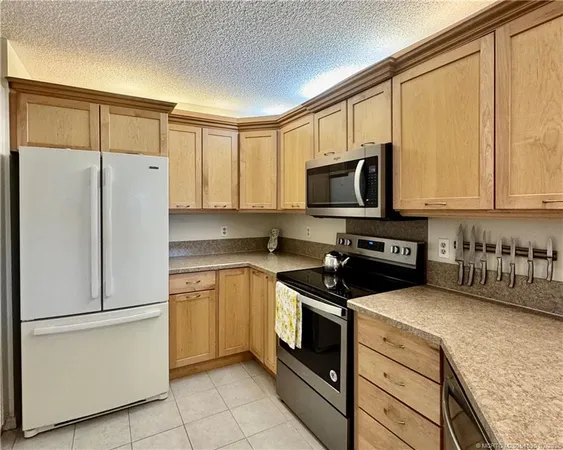 a bathroom with a sink and chandelier