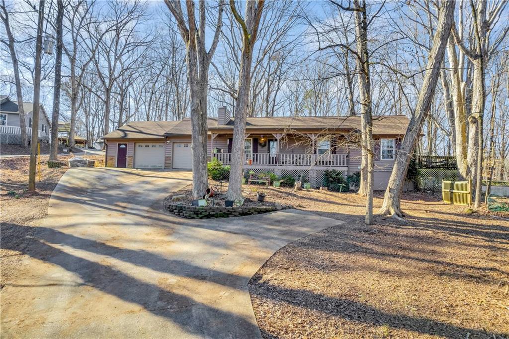 3398 Fork Road Gainesville, GA 30506 - Photo 1 of 1 a view of a house with garage and sitting area
