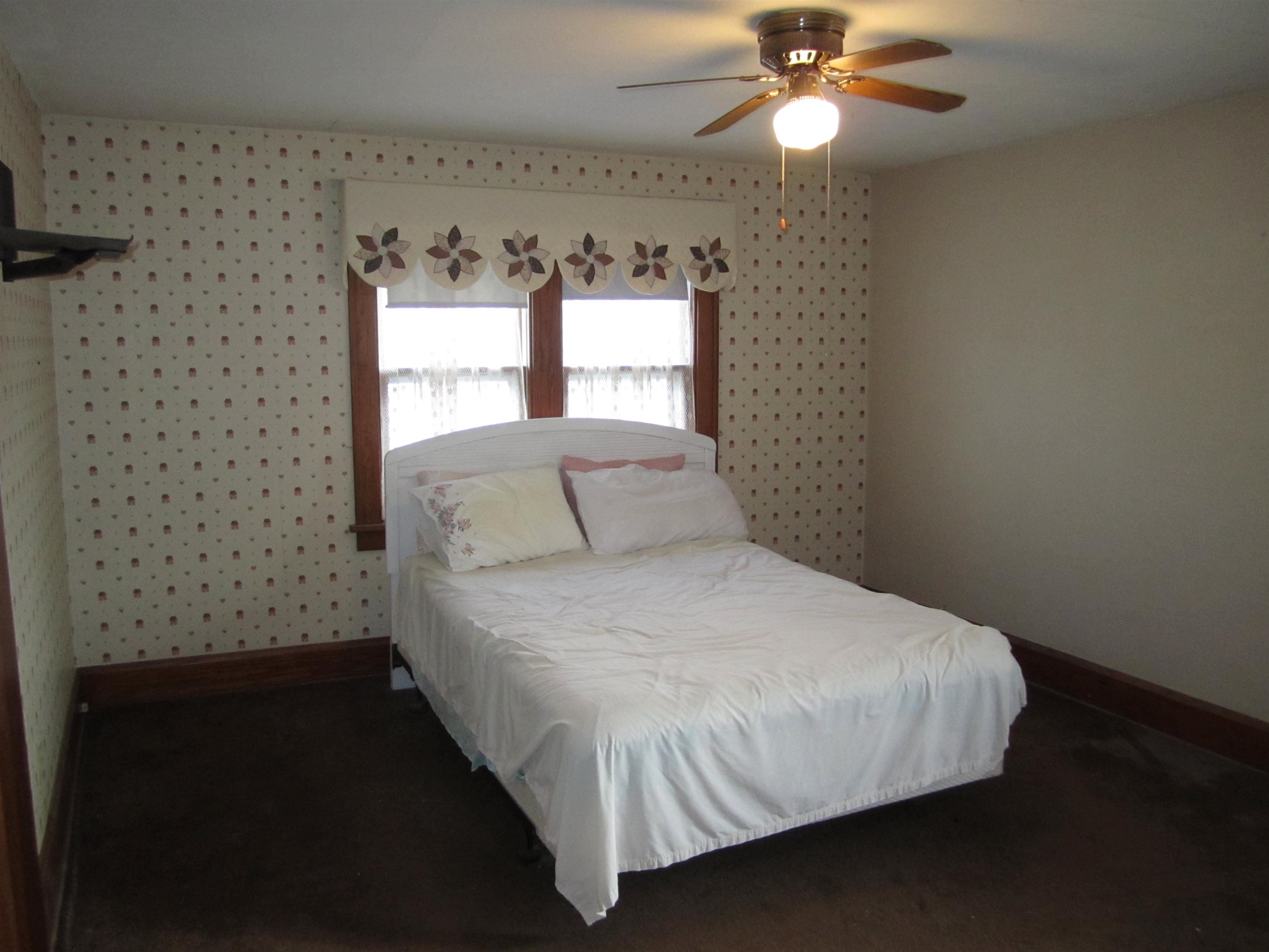 1107 South Main Street Belvidere, IL 61008 - Photo 11 of 21 a bedroom with a bed and a window