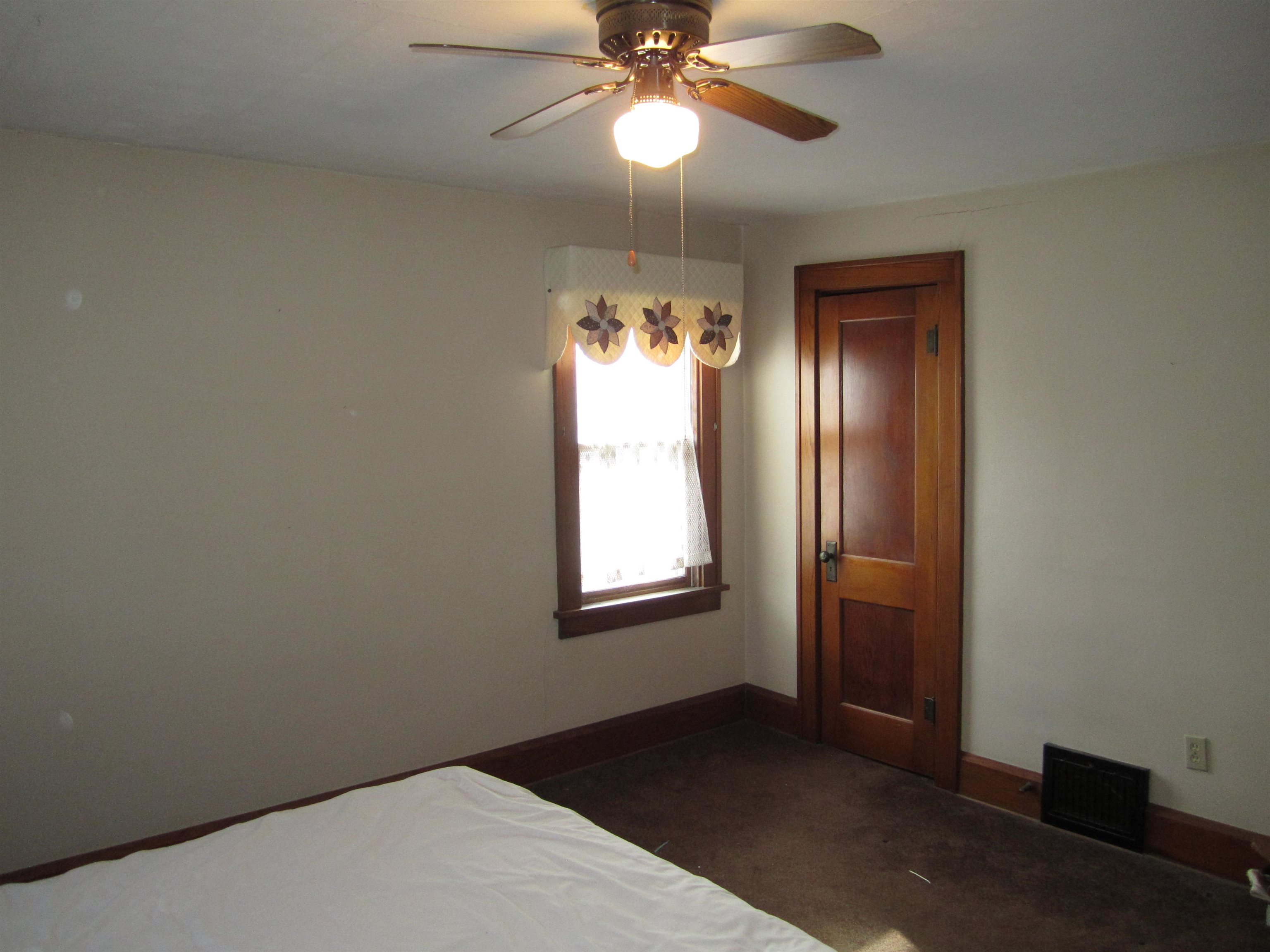 1107 South Main Street Belvidere, IL 61008 - Photo 12 of 21 a view of an empty room and window